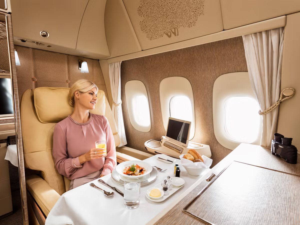 Passenger enjoying a meal in a private first class suite